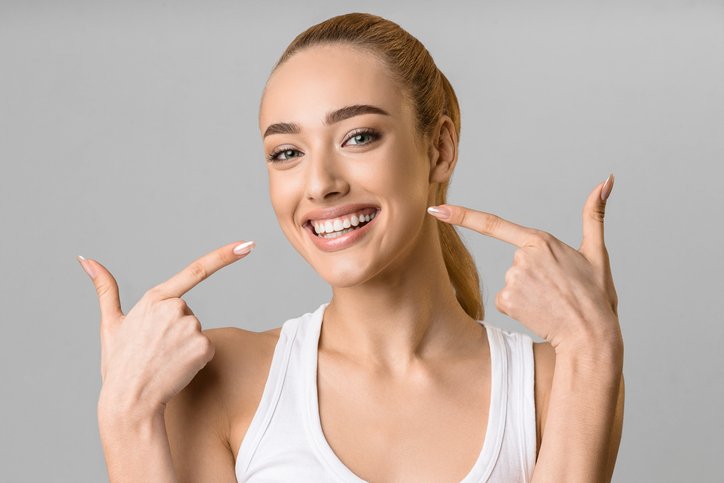 orthodontic concept. happy girl showing her beaming white teeth